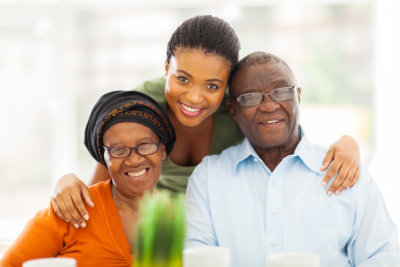 adult woman and senior couple smiling 