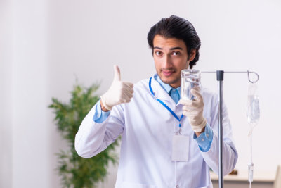 male nurse doing iv therapy