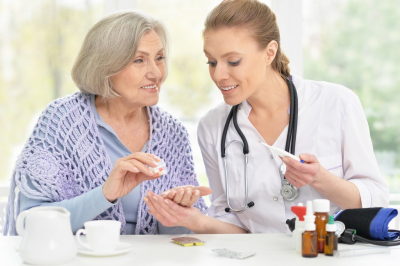 young nurse and her senior senior patient