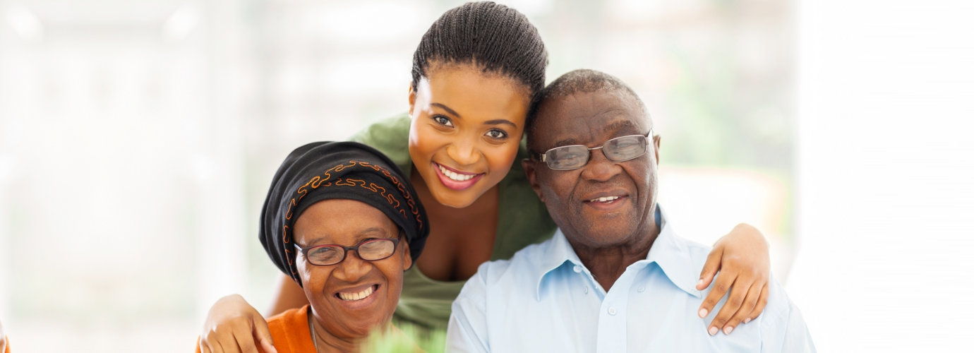 adult woman and senior couple smiling