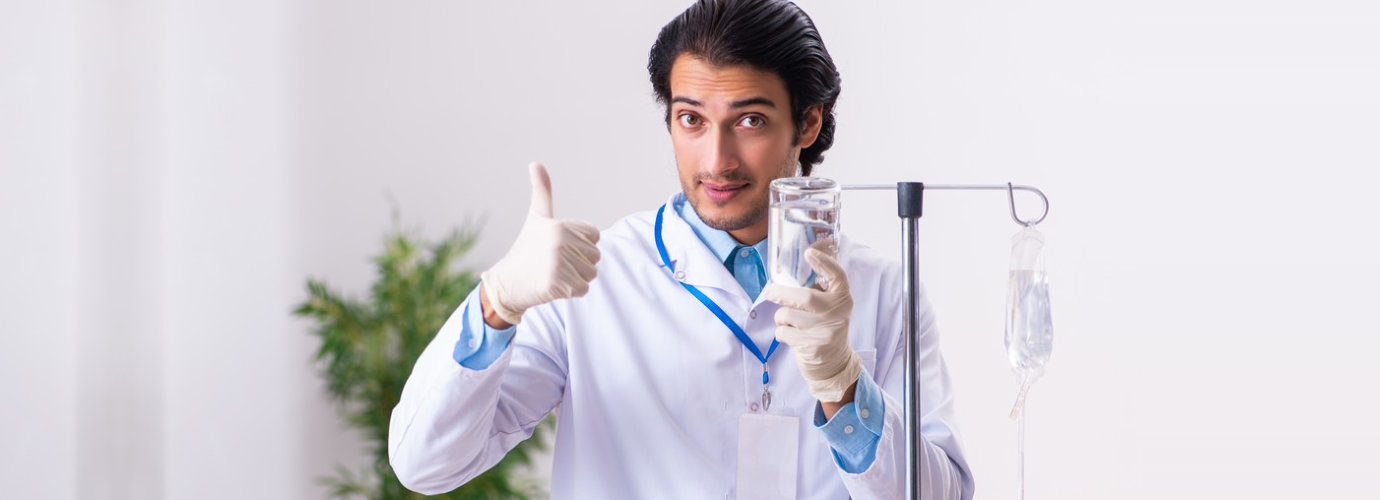 male nurse doing iv therapy